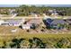 Overhead shot displaying the home's screened-in patio, convenient shed, and well-maintained landscaping at 3835 W Price Blvd, North Port, FL 34286