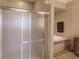 The bathroom showcases a tiled shower with glass doors, complemented by a luxurious bathtub at 3835 W Price Blvd, North Port, FL 34286
