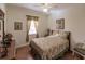 Relaxing bedroom featuring a patterned bedspread, wood floors, and soft natural light at 3835 W Price Blvd, North Port, FL 34286