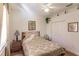 Cozy bedroom featuring a patterned bedspread, hardwood floors and natural light at 3835 W Price Blvd, North Port, FL 34286