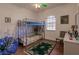 A bedroom featuring a bunk bed, hardwood floors and neutral wall colors at 3835 W Price Blvd, North Port, FL 34286