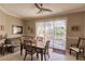 Dining room with sliding glass doors, comfortable seating, and neutral decor at 3835 W Price Blvd, North Port, FL 34286