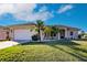 Charming single-story home with well-manicured lawn and tropical landscaping, freshly painted at 3835 W Price Blvd, North Port, FL 34286