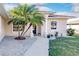 Home's entrance features decorative columns, rock garden and fresh landscaping at 3835 W Price Blvd, North Port, FL 34286