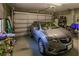Spacious two-car garage with ample storage space and a well-maintained interior; car shown for scale at 3835 W Price Blvd, North Port, FL 34286