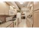 Traditional style kitchen with granite countertops, stainless steel appliances, and bright overhead lighting at 3835 W Price Blvd, North Port, FL 34286