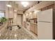 Well-equipped kitchen features granite countertops, tile backsplash, and stainless steel appliances at 3835 W Price Blvd, North Port, FL 34286