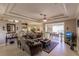 Spacious living room with elegant tray ceiling, neutral decor and open floor plan at 3835 W Price Blvd, North Port, FL 34286