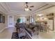 Bright and airy living space open to the kitchen featuring comfortable seating and neutral color palette at 3835 W Price Blvd, North Port, FL 34286