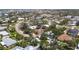 Wide aerial view of the home in a lush neighborhood at 417 Park Lane Dr, Venice, FL 34285