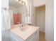 Bathroom with white vanity, faucet sink, and updated lighting at 417 Park Lane Dr, Venice, FL 34285