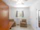 Versatile room featuring a Murphy bed with two accent chairs, and ample closet space at 417 Park Lane Dr, Venice, FL 34285