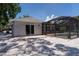 Rear view of home with pool and screened enclosure at 417 Park Lane Dr, Venice, FL 34285