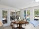 Bright Florida room with views of screened pool. Ideal for dining and relaxing, seamlessly blends indoor/outdoor living at 417 Park Lane Dr, Venice, FL 34285