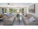 Relaxing Florida room offering views of the pool area with comfortable seating arrangements and serene, private feel at 417 Park Lane Dr, Venice, FL 34285