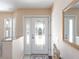 Bright entryway featuring decorative glass door and stylish accents at 417 Park Lane Dr, Venice, FL 34285