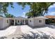 Attractive home featuring a well-manicured lawn and inviting entryway, accentuated by white gravel landscaping at 417 Park Lane Dr, Venice, FL 34285
