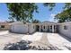 Lovely home featuring a clean facade, a well-kept lawn, and an attached two-car garage at 417 Park Lane Dr, Venice, FL 34285