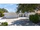 Charming single-story home with a two-car garage, driveway, and inviting front porch at 417 Park Lane Dr, Venice, FL 34285