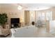 Cozy living room featuring neutral tones, tile flooring, and plenty of natural light at 417 Park Lane Dr, Venice, FL 34285