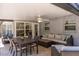 Inviting covered patio featuring a dining area and lounge, perfect for outdoor entertaining and relaxation at 417 Park Lane Dr, Venice, FL 34285