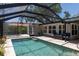 Sparkling pool inside screened enclosure, offering a private outdoor oasis at 417 Park Lane Dr, Venice, FL 34285