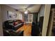 Comfortable living room with hardwood floors, a ceiling fan, and modern decor at 4223 Sawyer Rd, Sarasota, FL 34233