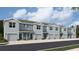 Beautiful townhomes showing a well-maintained facade, driveways, and landscaping at 4302 Miller Point Ct, Bradenton, FL 34208