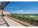 Spacious balcony with seating offers panoramic views of the golf course and ocean beyond at 435 L Ambiance Dr # Ph-J, Longboat Key, FL 34228