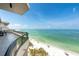 Expansive outdoor balcony with beach and ocean views and seating area at 435 L Ambiance Dr # Ph-J, Longboat Key, FL 34228