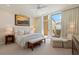 The bedroom features a view, access to the balcony, a king bed and is light and bright at 435 L Ambiance Dr # Ph-J, Longboat Key, FL 34228