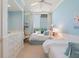 Cozy bedroom features two beds, natural light, and access to the balcony at 435 L Ambiance Dr # Ph-J, Longboat Key, FL 34228