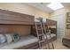 Bedroom for featuring bunkbeds with a ladder and decorative pillows at 435 L Ambiance Dr # Ph-J, Longboat Key, FL 34228