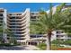 Luxury condo building featuring multi-story architecture, private balconies, and elegant entrance at 435 L Ambiance Dr # Ph-J, Longboat Key, FL 34228