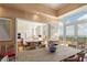 Open-plan dining area features views, access to the balcony, and an open-plan living area with wood-style flooring at 435 L Ambiance Dr # Ph-J, Longboat Key, FL 34228
