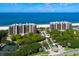 Luxury beachfront condominiums featuring stunning ocean views, lush landscaping, and resort-style amenities at 435 L Ambiance Dr # Ph-J, Longboat Key, FL 34228