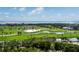Picturesque golf course with palm trees and water features offering a serene and luxurious backdrop at 435 L Ambiance Dr # Ph-J, Longboat Key, FL 34228