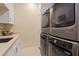 Laundry room includes modern appliances, countertops, and storage space at 435 L Ambiance Dr # Ph-J, Longboat Key, FL 34228
