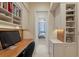 Functional office space with desk, custom cabinets, and natural light at 435 L Ambiance Dr # Ph-J, Longboat Key, FL 34228