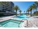 Beautiful pool and spa area surrounded by tropical palms offer a resort-style experience at 435 L Ambiance Dr # Ph-J, Longboat Key, FL 34228