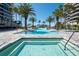 Beautiful pool and spa area surrounded by tropical palms offer a resort-style experience at 435 L Ambiance Dr # Ph-J, Longboat Key, FL 34228