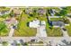 An attractive house boasts a verdant lawn with new palm trees and a white stone driveway at 4519 Brooksdale Dr, Sarasota, FL 34232