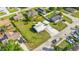 Charming single-story home with a well-maintained lawn, mature trees, and a lengthy white stone driveway at 4519 Brooksdale Dr, Sarasota, FL 34232