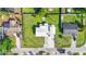 Aerial view of a well-maintained property with a spacious yard, boat storage, and convenient street access at 4519 Brooksdale Dr, Sarasota, FL 34232