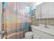 Cozy bathroom featuring modern fixtures, vanity, and shower with decorative curtain at 4519 Brooksdale Dr, Sarasota, FL 34232