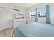 Bright bedroom with white dresser, modern decor, and natural light at 4519 Brooksdale Dr, Sarasota, FL 34232