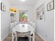 Bright dining area featuring white walls, a large window, shelving and seating for six at 4519 Brooksdale Dr, Sarasota, FL 34232