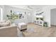 The living room is bright and airy, featuring a comfortable couch and entertainment center at 4519 Brooksdale Dr, Sarasota, FL 34232