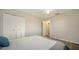 Comfortable bedroom showcasing a closet, a ceiling fan, and a neutral color scheme at 4611 Spahn St, Sarasota, FL 34232