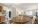 Dining area with a round table and seating for four, open to the living area and kitchen at 4611 Spahn St, Sarasota, FL 34232